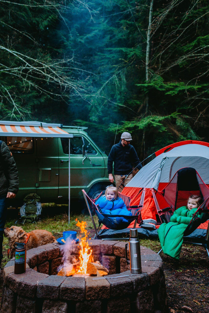 2 Toddlers in Big Mo 40° Kids Sleeping Bags (Ages 2-4) Sitting Around Fire in Chairs Outside Camping Warm and Happy - Morrison Outdoors