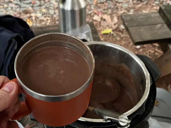 Hot chocolate in a Yeti Mug at a campsite