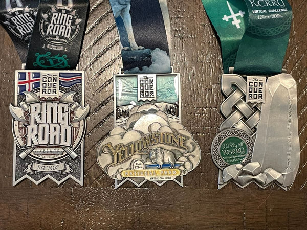 Medals earned from the Conqueror virtual challenges including Ring Road, Ring of Kerry, and Lands End